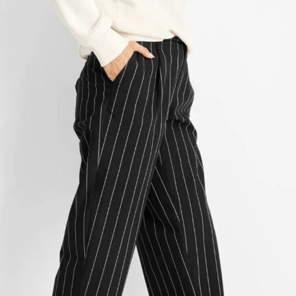 Black pinstripes trousers. Strech band . Slip on. Breathable.